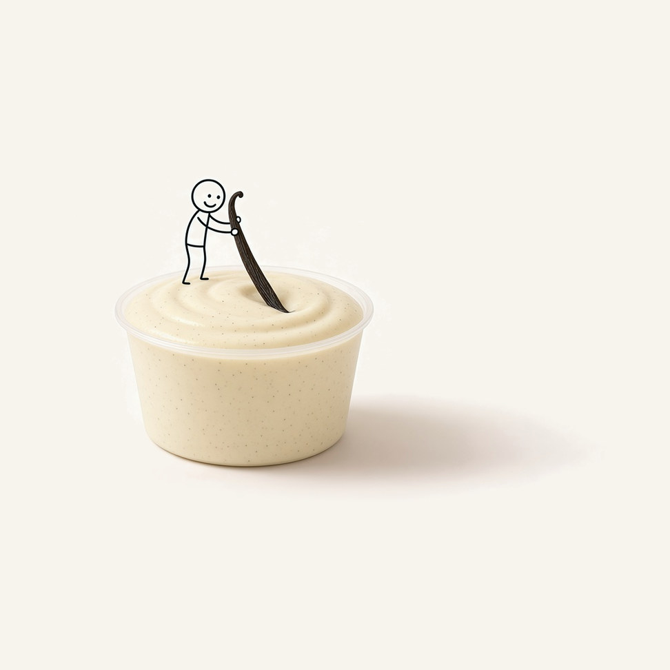 Vanilla microwave smoothie in a clear cup, with a figure rolling a vanilla pod like a rolling pin