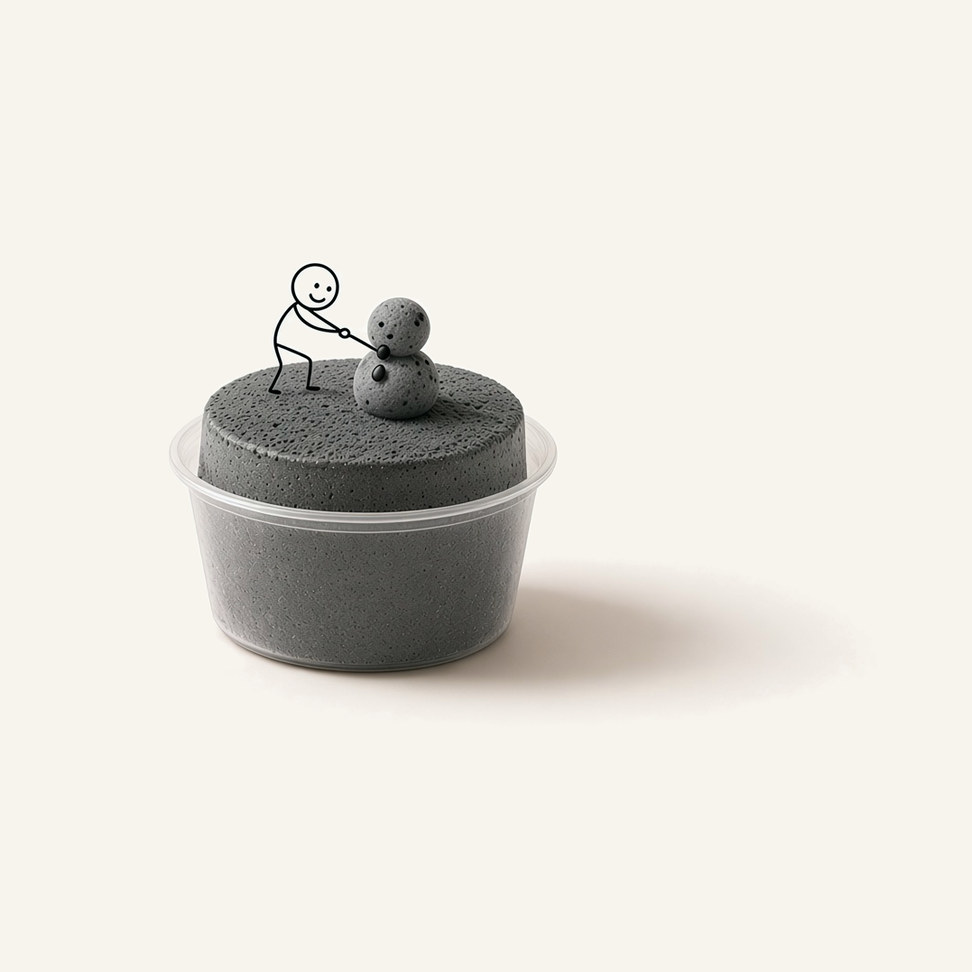 Black Sesame snow ice block in a clear cup, with a line-drawn figure on top